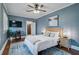Bedroom with ceiling fan, hardwood floors, and a queen-size bed at 301 W South Ave, Tampa, FL 33603