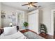 Bright bedroom offers hardwood floors, a ceiling fan, and closet for ample storage at 301 W South Ave, Tampa, FL 33603