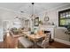 Elegant dining room with hardwood floors, decorative lighting, and a cozy fireplace at 301 W South Ave, Tampa, FL 33603