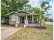 Charming bungalow-style home featuring a covered front porch and well-maintained landscaping at 301 W South Ave, Tampa, FL 33603