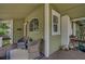 Charming front porch with seating area, perfect for relaxing and enjoying the outdoors at 301 W South Ave, Tampa, FL 33603