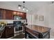 Kitchen with stainless steel appliances, ample counter space, and stylish lighting fixtures at 301 W South Ave, Tampa, FL 33603
