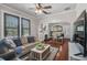 Cozy living room showcasing hardwood floors, abundant natural light, and an open layout at 301 W South Ave, Tampa, FL 33603