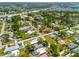 A neighborhood featuring mature trees, community pools, and proximity to urban amenities at 302 Pavonia Rd, Nokomis, FL 34275