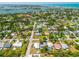 Beautiful aerial view of a charming neighborhood featuring lush landscapes and inviting homes near the water at 302 Pavonia Rd, Nokomis, FL 34275