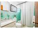 Refreshing bathroom features tile accents and a shower/tub combination at 302 Pavonia Rd, Nokomis, FL 34275