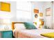 Charming bedroom with unique wall art, matching side tables, and a comfortable bed with stylish throw pillows at 302 Pavonia Rd, Nokomis, FL 34275
