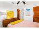 Bedroom featuring bright decor, wood doors, and simple decorations at 302 Pavonia Rd, Nokomis, FL 34275