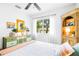 Bright bedroom features modern design, large window, and stylish furniture at 302 Pavonia Rd, Nokomis, FL 34275