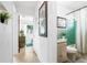 Hallway view to bedroom and bathroom featuring well-lit space at 302 Pavonia Rd, Nokomis, FL 34275