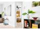 Hallway leading to the bedroom; artwork and plants add visual interest and character at 302 Pavonia Rd, Nokomis, FL 34275