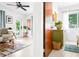 Hallway view into a bedroom and living area, showcasing the home's layout at 302 Pavonia Rd, Nokomis, FL 34275