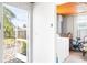 Bright laundry room with modern appliances and convenient access to the backyard patio at 302 Pavonia Rd, Nokomis, FL 34275