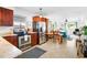 Open floor plan showcases a kitchen with stainless appliances and bright living space with stylish decor at 302 Pavonia Rd, Nokomis, FL 34275