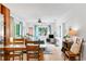 Bright living space featuring a dining area, comfortable seating, and an abundance of natural light at 302 Pavonia Rd, Nokomis, FL 34275