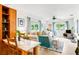 Inviting living room with comfortable seating, stylish decor, and natural light streaming through the windows at 302 Pavonia Rd, Nokomis, FL 34275