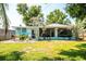 Charming home with a well-maintained backyard, cozy patio, and lush landscaping at 302 Pavonia Rd, Nokomis, FL 34275