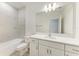 Modern bathroom featuring a marble-tiled shower/tub, single sink vanity, and neutral tones at 305 Via Tuscany Ave, Sarasota, FL 34243
