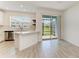 Bright kitchen featuring stainless steel appliances, and sliding glass doors to a screened in lanai at 305 Via Tuscany Ave, Sarasota, FL 34243
