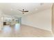 Open layout showcasing living space, and modern kitchen with stainless appliances at 305 Via Tuscany Ave, Sarasota, FL 34243