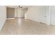 Open-concept living space featuring tile flooring, a fan, and lots of natural light at 305 Via Tuscany Ave, Sarasota, FL 34243