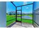 Screened-in lanai offers pond views, pavers and screened enclosure at 305 Via Tuscany Ave, Sarasota, FL 34243