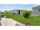 Spacious backyard featuring a lush lawn and mature landscaping, perfect for outdoor enjoyment at 3214 Sycamore Ter, Sarasota, FL 34237