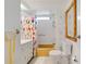 Bathroom with colorful shower curtain, vanity, and bright white fixtures at 3214 Sycamore Ter, Sarasota, FL 34237