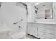 Modern bathroom with grab bars, white vanity and ample cabinet space at 3214 Sycamore Ter, Sarasota, FL 34237