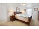 Cozy bedroom with wooden furniture, lamps, and natural light at 3214 Sycamore Ter, Sarasota, FL 34237