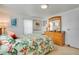 Light bedroom with neutral carpeting, and dresser with mirror at 3214 Sycamore Ter, Sarasota, FL 34237