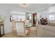 Bright dining room featuring a glass table with seating for four with easy access to the living areas at 3214 Sycamore Ter, Sarasota, FL 34237