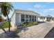Charming single-story home with a well-maintained brick driveway and lush landscaping featuring a beautiful palm tree at 3214 Sycamore Ter, Sarasota, FL 34237