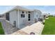 Charming single-story home with a cozy patio, bench, and well-maintained landscaping at 3214 Sycamore Ter, Sarasota, FL 34237