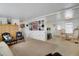 Spacious living room with built-in shelving and easy access to the dining area and kitchen at 3214 Sycamore Ter, Sarasota, FL 34237