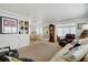 Open concept living room with built-in shelving and access to the dining room and sitting area at 3214 Sycamore Ter, Sarasota, FL 34237