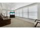 Sunroom or Bonus room filled with light and featuring a comfortable leather chair and lots of light at 3214 Sycamore Ter, Sarasota, FL 34237