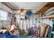 Storage area with an assortment of tools, lawncare items, and seating at 3214 Sycamore Ter, Sarasota, FL 34237