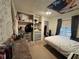 Simple bedroom with an organized closet space and a comfortable bed, perfect for a restful night at 322 34Th W St, Bradenton, FL 34205