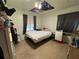 Practical bedroom featuring a bed, side table, and storage, suitable for functional living at 322 34Th W St, Bradenton, FL 34205