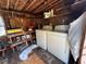 Interior laundry room with washer, dryer, work bench, and lots of miscellaneous items at 322 34Th W St, Bradenton, FL 34205