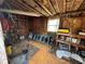 Interior of the shed featuring pegboard walls, ladder, shelving and plenty of tools at 322 34Th W St, Bradenton, FL 34205