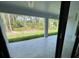 Covered patio offers a serene view of the lush green backyard and provides a perfect outdoor living space at 3386 Irma St, North Port, FL 34291