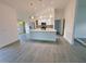 Bright, open-concept kitchen with stainless steel appliances, marble countertops, and large island at 3398 Escobar Ln, North Port, FL 34286