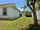 Spacious backyard featuring healthy green lawn and beautiful shade trees at 3828 6Th W Ave, Palmetto, FL 34221