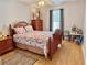 Bedroom with a comfortable bed, nightstands, and a cozy seating area by the window at 3828 6Th W Ave, Palmetto, FL 34221
