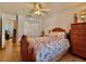 Bright bedroom features seashell bedding, wood floors, ceiling fan, and spacious closet at 3828 6Th W Ave, Palmetto, FL 34221