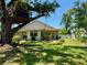 Charming home featuring a lush front yard with a unique treehouse feature at 3828 6Th W Ave, Palmetto, FL 34221