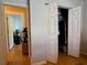Hallway offers a peek into another room and features access to a closet with storage at 3828 6Th W Ave, Palmetto, FL 34221