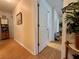 Bright hallway featuring laminate floors, leading to the bedrooms at 3828 6Th W Ave, Palmetto, FL 34221